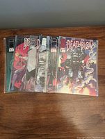 Six Deathblow comic books arranged side by side showing cover art and edges in protective bags.