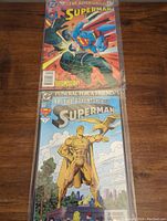 Photo of both comics #497 and #499 showing front covers plus comics bagged