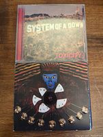 Photo of System of a Down Toxicity album front cover in jewel case.