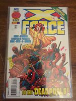 Front cover of Marvel Comics X-Force #56 comic book with multiple Deadpools and a female character in yellow.