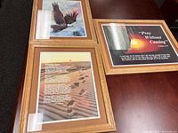 Three framed Christian wall art pieces displayed together, showing each artwork and the scripture text in frames with light wood borders.