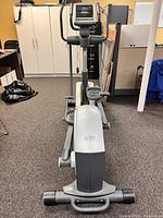 Front view of the Reebok Stride Select RL 6.0 elliptical showing pedals, handles, and control console.