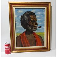 Framed oil painting of Aboriginal man with pipe shown with soda can for scale indoors on white background.