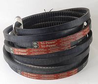 Side view of three stacked Gates Tri-Power V-belts showing the product label stripe and belt teeth