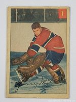 Front of 1954-55 Parkhurst Gerry McNeil hockey card showing the player in goalie position with red and blue Montreal Canadiens uniform.