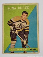 Front of 1958-59 Topps Johnny Bucyk hockey card showing player image and team info