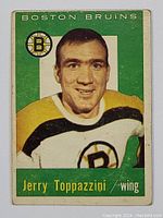 Front of the 1959-60 Topps Jerry Toppazzini Boston Bruins hockey card showing player portrait and team.