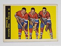 Front of 1960-61 Parkhurst hockey card showing three Montreal Canadiens players in uniform.