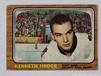 Front of the vintage 1966-67 Topps Ken Hodge hockey card showing player in Black Hawks jersey with crowd background.