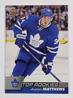 Front side of the 2016 Upper Deck Top Rookies Auston Matthews rookie card showing him in Toronto Maple Leafs uniform.
