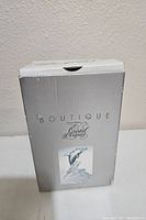 Original branded box for Boutique Cristal d'Arques dolphin figurine with label and image.