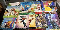 Photo displaying 11 assorted children's books including Disney and Marvel titles.