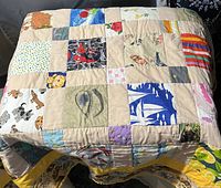 Photo showing full patchwork bed throw with various children's themed fabric squares, good condition.