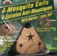 Photo of packaging showing 4 mosquito coils and ceramic burner with star cutouts, Summer Lights brand for outdoor use only