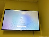 Samsung flat screen TV displaying 'No Signal' on screen.