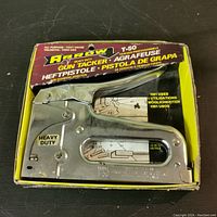 Arrow heavy duty T-50 stapler in original box with front view showing model and heavy duty label.