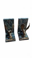 Pair of green marble L-shaped bookends with brass eagle sculptures with wings spread.