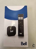 Front packaging showing Bell streaming device and remote control with Bell branding