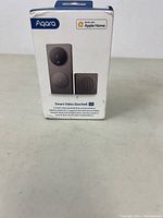 Front view of Aqara Smart Video Doorbell G4 package showing product image and Apple Home compatibility