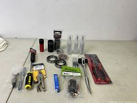 Full lot view showing various tools and bearings on a beige table