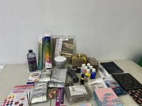 Overview of craft supplies including paint, vinyl, brushes, epoxy resin, and paints.