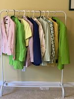 10 assorted women's jackets by ZARA in size 1X hanging on rack in various colors and styles.