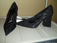 Pair of ZARA women's high heel shoes in black with a subtle cheetah print and block heels, size 8, new with original tag attached.