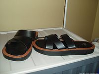 Photo of one pair of black ZARA slide sandals size 8 with three straps and thick sole