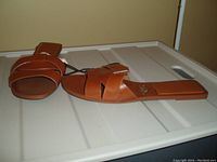 Pair of brown ZARA slides displayed side by side on a white surface, size 8, condition new with tags.