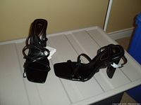 Pair of black ZARA women's heeled sandals, size 8, new with tags, showing strappy square open toe and block heel.