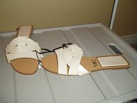 Single pair of beige ZARA slide sandals, size 8, new with tag visible, showing top and side angle of slides.