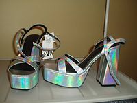 Pair of silver ankle wrap platform high heel shoes by ZARA, size 8, new with tags attached.