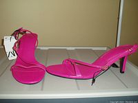 Photo of pair of bright pink women's high heel sandals by ZARA with tags, size 8, showing side and top views.