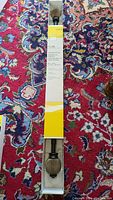 Full length view of boxed curtain rod showing packaging and length information on label.