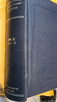 Spine view of the hardcover blue International Large Stamp Album, Part VI by Davidson Publications, New York.