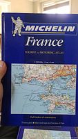 Front cover of Michelin France Tourist and Motoring Atlas showing blue cover with map excerpt and title.