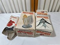 Three boxed Second Nature Whisper aquarium air pumps labeled 200, 600, and 900, boxes are used but pumps appear new inside.