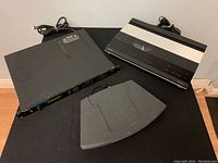 Full view of the three electronic items including Beogram CD X, Roland R-8M sound module, and Bose SoundTouch pedestal.