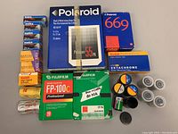 Overview of all film boxes and loose canisters on table