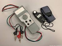 Full view of cables tester and light meter with case