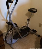 Full view of the Weslo Pursuit R 1.2 stationary exercise bike showing frame, seat, pedals, and flywheel.