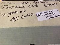 Box with handwritten label indicating 1992 football cards, 32 years old, 405 cards.