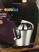 Photo of the original box showing Eurolux citrus juicer, model CJ-1600 S, 160 watt power.