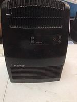 Front view showing Lasko logo, vent grills, and digital control panel with buttons.