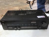 Front top angle view showing model and controls on the amplifier.