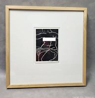 Full view of framed abstract nude art piece showing entire artwork, matting, and light wood frame.