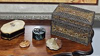 Overall view of all five items including decorative boxes, ring holder, and paper weight on table