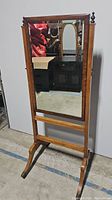 Full view of the full-length wooden cheval mirror with rectangular glass panel.