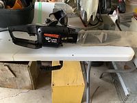 Side profile of Remington Limb N' Trim chainsaw showing the full 12-inch bar and body with handle.