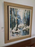 Framed oil painting showing the full piece on wall, capture of the setting and condition.